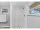 Clean, updated shower with white tile and mosaic floor at 4923 Azalea Dr, New Port Richey, FL 34652