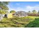Large backyard with screened pool and storage shed at 1010 59Th N Ave, St Petersburg, FL 33703