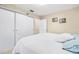 Bedroom with a large bed, white sliding doors to the closet, and additional storage at 1010 59Th N Ave, St Petersburg, FL 33703