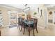 Bright dining room with dark wood table and access to the pool at 1010 59Th N Ave, St Petersburg, FL 33703