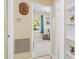 Hallway with access to bedroom, storage, and a view into the backyard at 1010 59Th N Ave, St Petersburg, FL 33703
