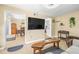 Spacious living room with large TV and view into dining area at 1010 59Th N Ave, St Petersburg, FL 33703