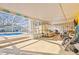 Relaxing poolside space with seating, and access from the covered patio at 1010 59Th N Ave, St Petersburg, FL 33703