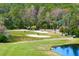 Golf course with players and carts at 10106 Radcliffe Dr, Tampa, FL 33626