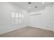 Bright bedroom with neutral carpeting and double doors at 10106 Radcliffe Dr, Tampa, FL 33626