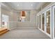 Spacious dining room with large windows, hardwood floor, and modern chandelier at 10106 Radcliffe Dr, Tampa, FL 33626
