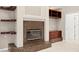 Elegant fireplace with mosaic tile surround and built-in shelving at 10106 Radcliffe Dr, Tampa, FL 33626