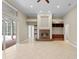 Living room with tile floors, fireplace, and built-in shelving at 10106 Radcliffe Dr, Tampa, FL 33626