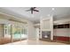 Spacious living room with pool view and fireplace at 10106 Radcliffe Dr, Tampa, FL 33626