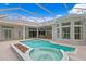 Large screened pool and spa with views of the home at 10106 Radcliffe Dr, Tampa, FL 33626