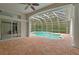 Relaxing screened pool and spa area with brick pavers at 10106 Radcliffe Dr, Tampa, FL 33626