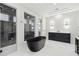 Spa-like bathroom with a freestanding tub and glass enclosed shower at 10639 Ruffino Ct, Trinity, FL 34655