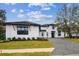 Stunning two-story home with a paver driveway and landscaped lawn at 10639 Ruffino Ct, Trinity, FL 34655