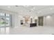 Open living space with large sliding doors leading to a patio at 10639 Ruffino Ct, Trinity, FL 34655