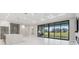 Living area with sliding doors, offering scenic outdoor views at 10639 Ruffino Ct, Trinity, FL 34655