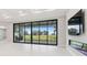 Living area with sliding glass doors and fireplace at 10639 Ruffino Ct, Trinity, FL 34655
