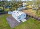 Aerial view of a metal garage on a grassy lot at 11303 Leprechaun Dr, Riverview, FL 33569