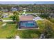 Aerial view of house and pool, surrounded by lush greenery at 11303 Leprechaun Dr, Riverview, FL 33569