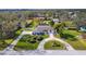 Aerial view of house with circular driveway and landscaped yard at 11303 Leprechaun Dr, Riverview, FL 33569
