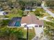 Aerial view showing home, pool, and surrounding landscape at 11303 Leprechaun Dr, Riverview, FL 33569