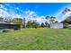 Large backyard with a shed and screened pool at 11303 Leprechaun Dr, Riverview, FL 33569