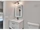 Updated bathroom with white vanity, and LED mirror at 11303 Leprechaun Dr, Riverview, FL 33569