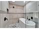 Spa-like bathroom with a soaking tub and a large shower at 11303 Leprechaun Dr, Riverview, FL 33569