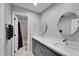 Double vanity bathroom with a large mirror at 11303 Leprechaun Dr, Riverview, FL 33569