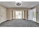 Spacious bedroom with gray carpet and access to the pool at 11303 Leprechaun Dr, Riverview, FL 33569
