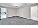 Bedroom with gray carpet and access to bathroom and fireplace at 11303 Leprechaun Dr, Riverview, FL 33569