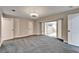 Bright bedroom with gray carpet and access to a sunroom at 11303 Leprechaun Dr, Riverview, FL 33569