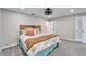 Spacious bedroom with ceiling fan and coastal decor at 11303 Leprechaun Dr, Riverview, FL 33569