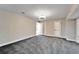 Large bedroom with gray carpet and ample closet space at 11303 Leprechaun Dr, Riverview, FL 33569