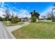 House exterior with a circular driveway and manicured lawn at 11303 Leprechaun Dr, Riverview, FL 33569