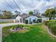 House exterior showcasing a two-car garage and well-manicured lawn at 11303 Leprechaun Dr, Riverview, FL 33569