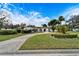 Single story home with circular driveway and landscaped yard at 11303 Leprechaun Dr, Riverview, FL 33569