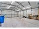 Bright and spacious garage interior with storage shelves at 11303 Leprechaun Dr, Riverview, FL 33569