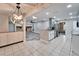 Open concept kitchen and living area with granite counters and island at 11303 Leprechaun Dr, Riverview, FL 33569