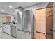 Modern kitchen with stainless steel appliances and granite countertops at 11303 Leprechaun Dr, Riverview, FL 33569