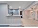 Kitchen with breakfast bar and view into the dining and living areas at 11303 Leprechaun Dr, Riverview, FL 33569