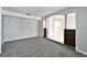 Spacious office area with carpet, neutral walls and built-in shelving at 11303 Leprechaun Dr, Riverview, FL 33569