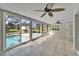 Sunroom with pool view and tile floors at 11303 Leprechaun Dr, Riverview, FL 33569