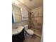 Bathroom with shower, toilet and dark vanity at 143 44Th N Ave, St Petersburg, FL 33703