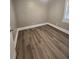 Bright bedroom featuring neutral walls and wood-look flooring at 143 44Th N Ave, St Petersburg, FL 33703