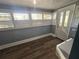 Inviting entryway with wood-look floors and white door at 143 44Th N Ave, St Petersburg, FL 33703