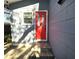 Bright red front door entry with brick walkway at 143 44Th N Ave, St Petersburg, FL 33703