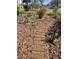 Landscaped garden path with wooden steps and lighting at 143 44Th N Ave, St Petersburg, FL 33703