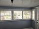 Sunroom with white shutters offering plenty of natural light at 143 44Th N Ave, St Petersburg, FL 33703