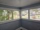 Sunroom with white shutters and view of neighborhood at 143 44Th N Ave, St Petersburg, FL 33703