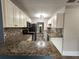 Modern kitchen featuring granite countertops and stainless steel appliances at 143 44Th N Ave, St Petersburg, FL 33703